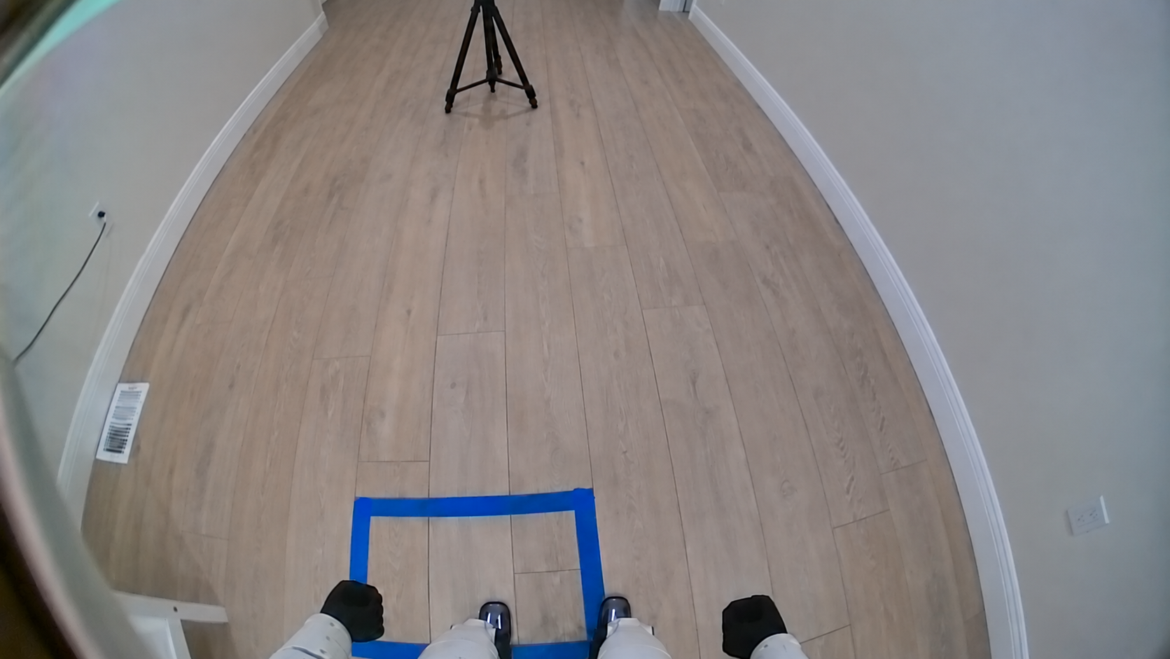 Final downward view with the feet straddling the near edge of the goal.